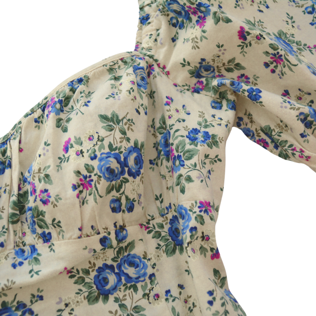 Vestido beige floral mangas globo