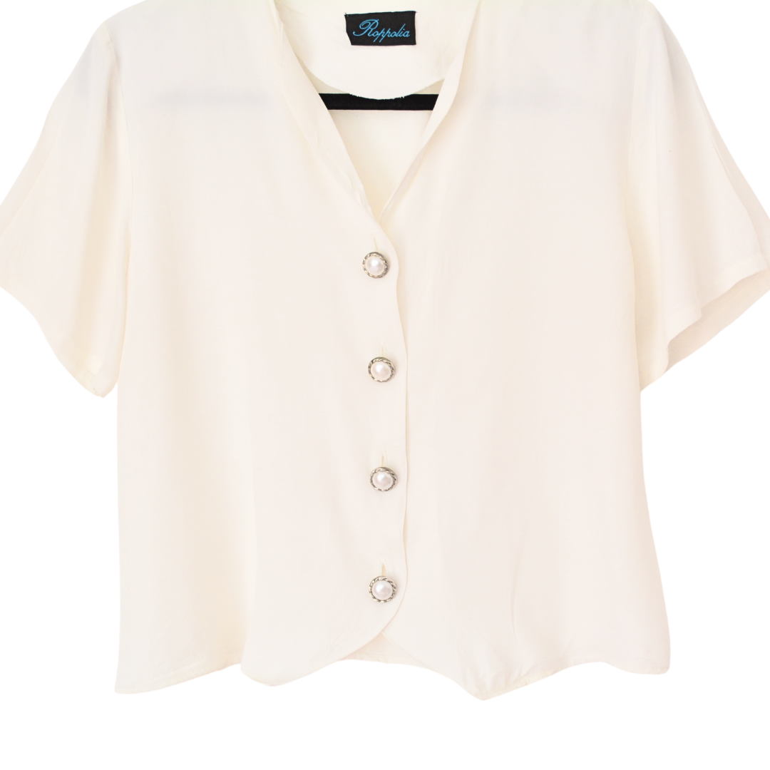 Blusa vintage beige con botones perla