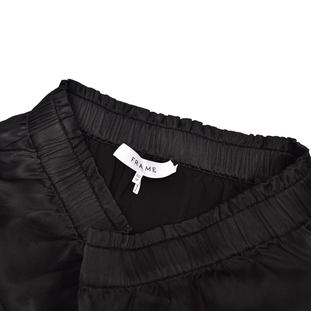 Enterizo negro satinado con bolsas