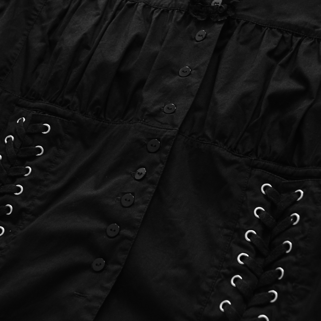 Blusa negra estilo corset